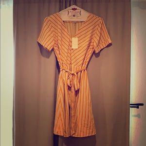 Brand new silky yellow striped dress. V neck.